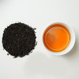 Organic Naturally Smoked Souchong Black Tea | Traditional pine smoke aroma wrapped in the sweetness of wild honey | Vibrant black tea with a golden ring | Certified Organic Black Tea | Limited Edition Handcrafted